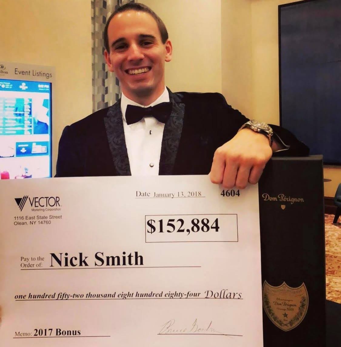 Nick Smith holding $152,884 Vector bonus check